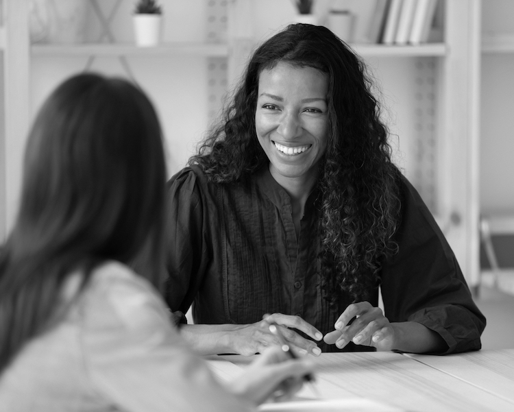 Female founder being coached by a professional