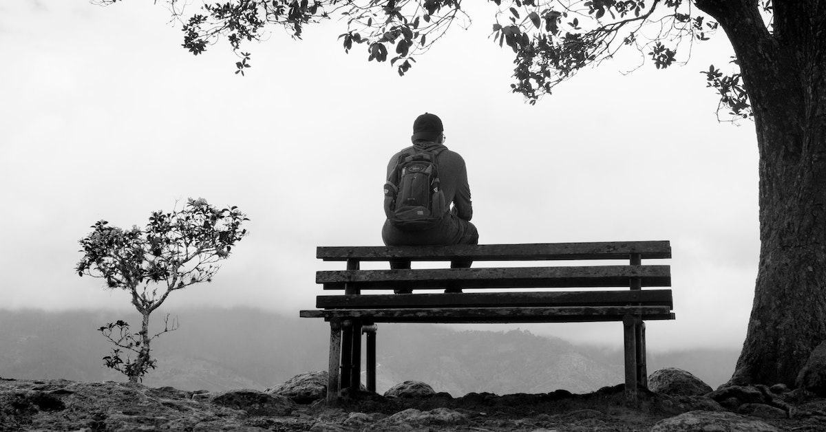 Introvert sitting on a bench